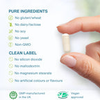 Hand holding a pill with purity and approval information on a white background