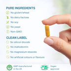 Hand holding a supplement capsule with purity and approval information on a white background