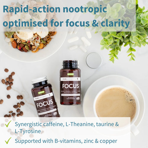 Vitamins labeled 'FOCUS' on a table with coffee, nuts, and a plant, promoting rapid-action nootropic for focus and clarity.