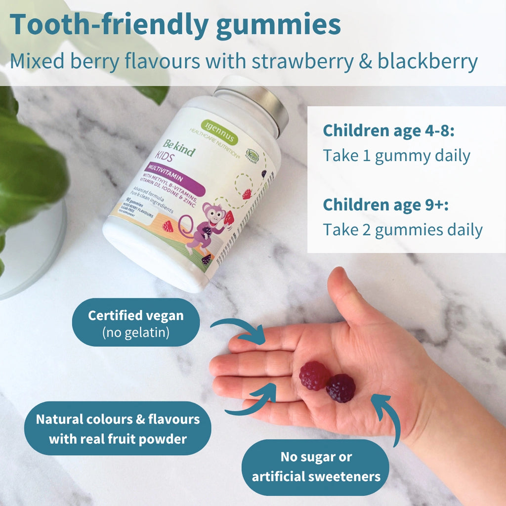Vitamin gummies with a bottle labeled 'The Kind Kids' on a marble surface.