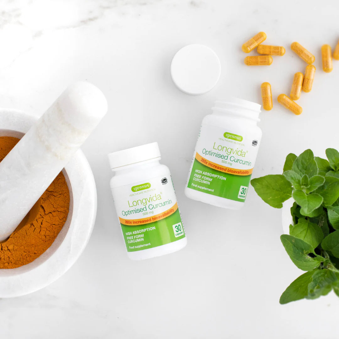 Two bottles of Longvida Optimised Curcumin with capsules and a plant on a white background