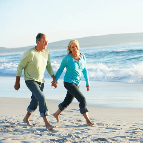 Senior couple walking on a beach