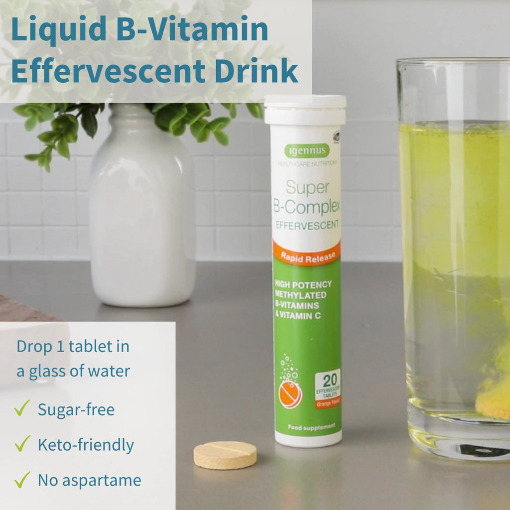 Super B-Complex effervescent drink tube with a tablet and glass of liquid on a table.