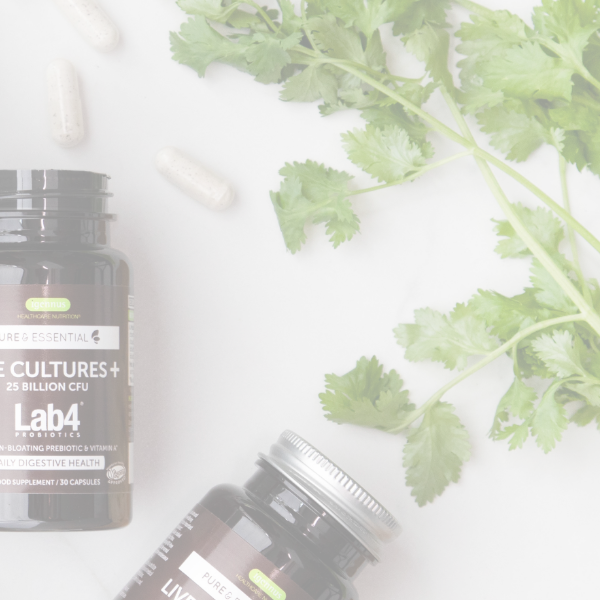 Supplement bottles with green leaves on a light background