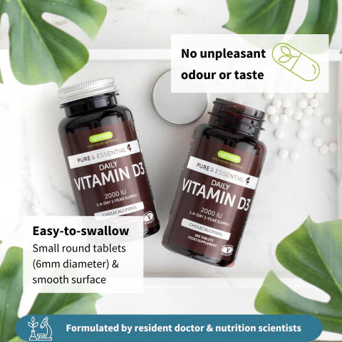 Two bottles of Pure Essence Labs Daily Vitamin D3 on a light background with green leaves.