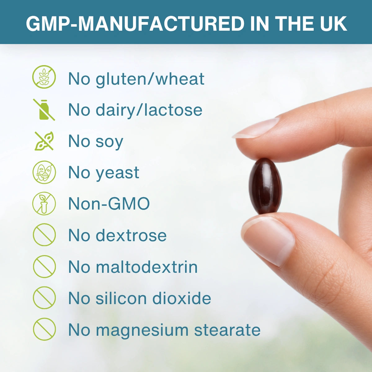 Hand holding a supplement pill with allergen information on a blurred natural background