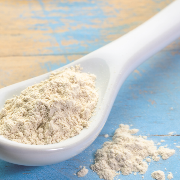 White spoon filled with ashwagandha