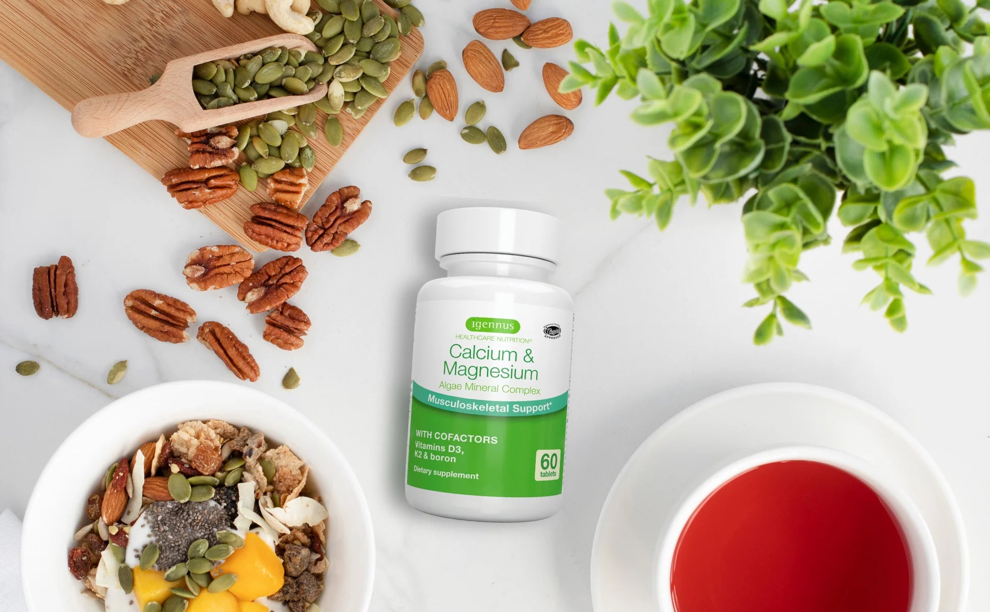 Supplement bottle labeled 'Calcium & Magnesium' on a table with food and plants.
