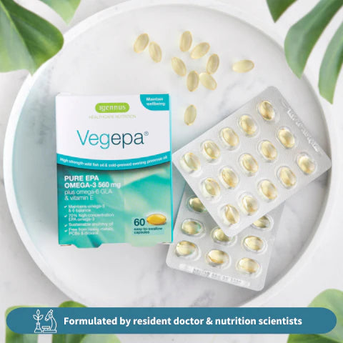 Vegepa Omega-3 supplement packaging on a white plate with green leaves in the background
