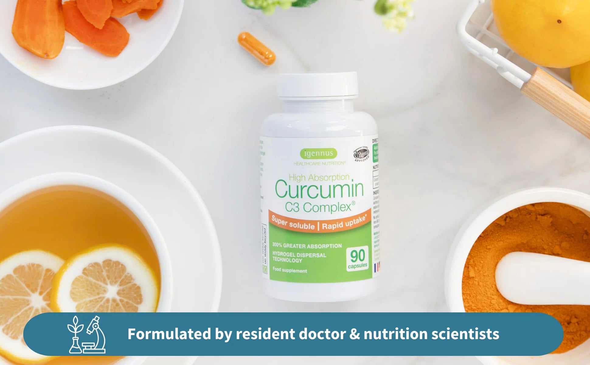 Supplement bottle labeled 'Curcumin C3 Complex' on a table with fruits and tea.