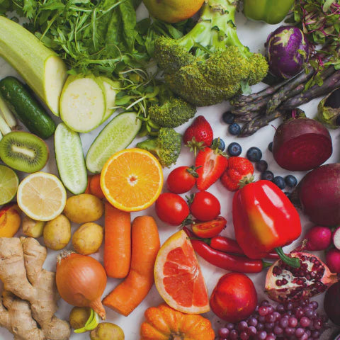 Assorted fruits and vegetables on a white background