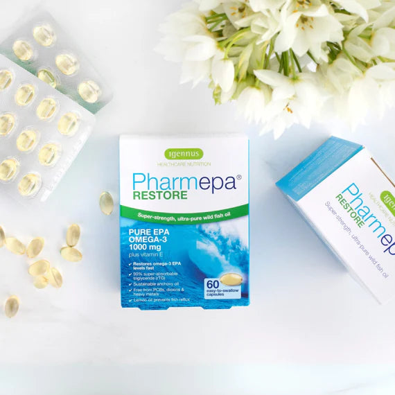 Pharmepa Restore supplement packaging with capsules and flowers on a light background