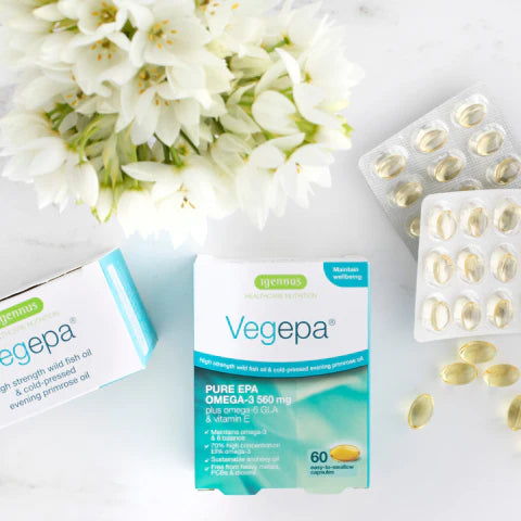 Vegepa Omega-3 supplement packaging with flowers on a light background